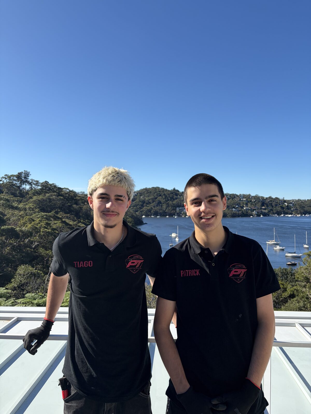 Patrick and Tiago, founders of PT Mobile Car Detailing, in branded polos